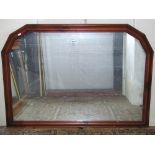 An overmantle mirror of rectangular form with moulded stained pine and canted frame, 125 cm x 88 cm
