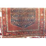 Kashmir type rug, with geometric decoration upon an orange and indigo ground, 170 x 125cm