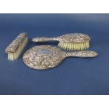 1970s three piece Victorian style silver dressing set comprising two brushes and a mirror (3)