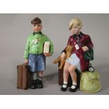 A pair of Royal Doulton limited edition figures The Boy Evacuee HN3202 and The Girl Evacuee