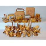 A box containing a large collection of Jerusalem souvenir wares mainly in olive wood to include book