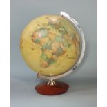 illuminated terrestrial globe upon a teak stand, inscribed with various sea mans voyages, 36cm high