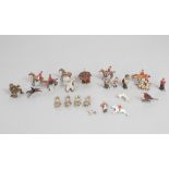 A collection of miniature Edwardian lead animals and figures including fox hounds,huntsman and
