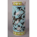 A 19th century oriental vase of cylindrical form with polychrome painted dragon and flowering tree