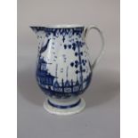 A late pearlware 18th century jug in the Worcester manner with blue and white painted chinoiserie