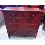 An early 19th century mahogany bedroom chest of two short over three long graduated drawers with