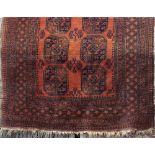 Bokhara rug with typical geometric medallion decorated with typical geometric medallion decoration