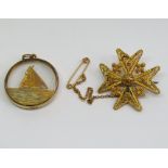 9ct pendant depicting a sailing yacht and a filigree Maltese cross brooch in indistinctly marked