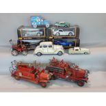Toy vehicle collection including 4 boxed Maisto Special Edition cars, 2 tin plate model fire engines