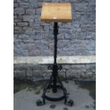 A good quality ecclesiastical floorstanding lecturn with light oak rest, raised on a wrought iron