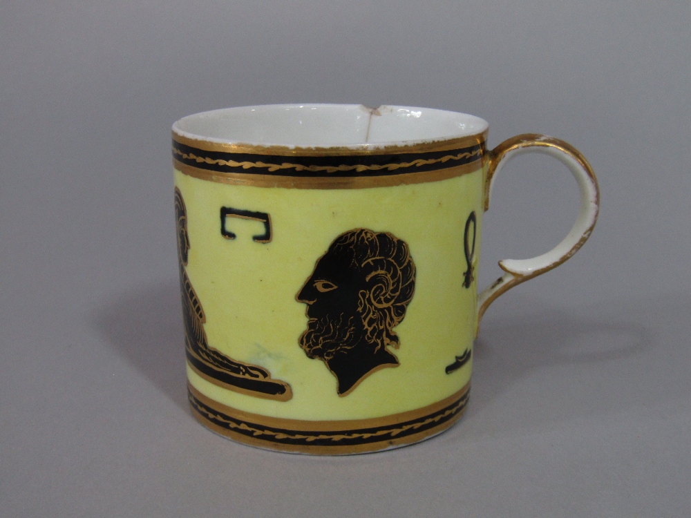 An unusual early 19th century Derby coffee can with black and gilt Egyptian style motifs on a yellow