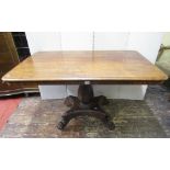 A late Regency mahogany breakfast table, the rectangular top raised on a rectangular vase shaped