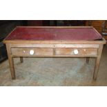 A low 19th century stripped pine farmhouse kitchen or dairy table of rectangular form, fitted with