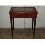 A reproduction walnut veneered vitrine or bijouterie table of rectangular form with inlaid
