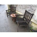 A pair of contemporary weathered teak open armchairs with slatted seats and backs, together with a