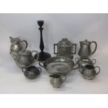 A collection of various planished pewter teawares to include tudric and WH Hassler, together with