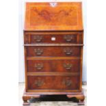 A good quality reproduction Georgian style walnut veneered ladies writing bureau, the fall flap with