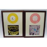 Four framed vinyl singles comprising Squeeze - Cool for Cats, The Specials - 2 Tone Gangsters,