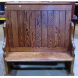 A pitch pine pew, with plank seat, shaped ends and raised tongue and groove boarded back, 126cm long