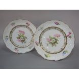 A pair of early 19th century Nantgarw dessert plates, with relief moulded borders and painted floral