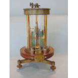 A Victorian torsion galvanometer by Siemen Bros no 5896, the brass and cylindrical glass framework