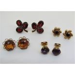 Four pairs of 9ct gem set stud earrings to include a good amethyst pair and a garnet trefoil cluster