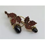 Good Victorian Bohemian pyrope garnet encrusted brooch in the form of a fruiting vine, in yellow
