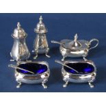 Silver five piece cruet comprising two salts, two peppers, mustard and three spoons, with two