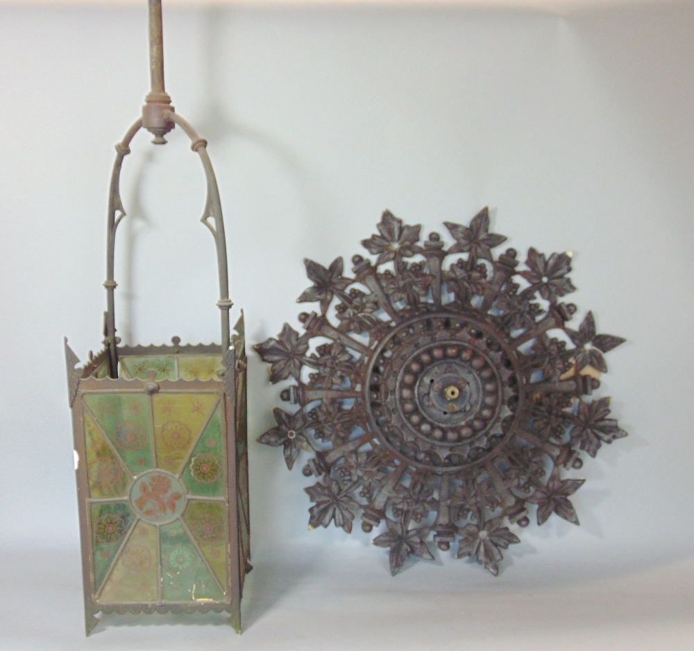 A Victorian brass framed hall lantern of square cut form with original painted leaded light panels