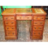 A good quality Victorian mahogany pedestal desk fitted with an arrangement of nine drawers, each