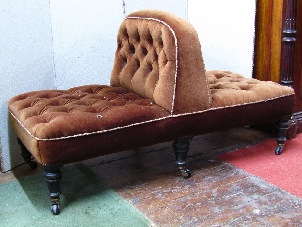 A Victorian centre seat of rectangular form with central button division - to seat two, raised on