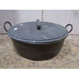 A large 19th century oval copper two handled cooking pan and cover