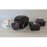 Mamiya 645 camera with 80mm lens and various reels and others (a collection)