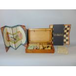 A good early 20th century oak cased gaming box to include draughts, dominoes, chess, racing game,