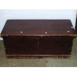 A 19th century stained pine blanket box with hinged lid and side carrying handles