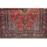 Full pile Persian Sarouk carpet, red ground, 300 x 220cm