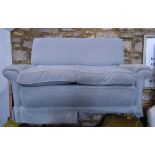 A pair of good quality contemporary, but traditional style two-seat sofas, with swept and rolled