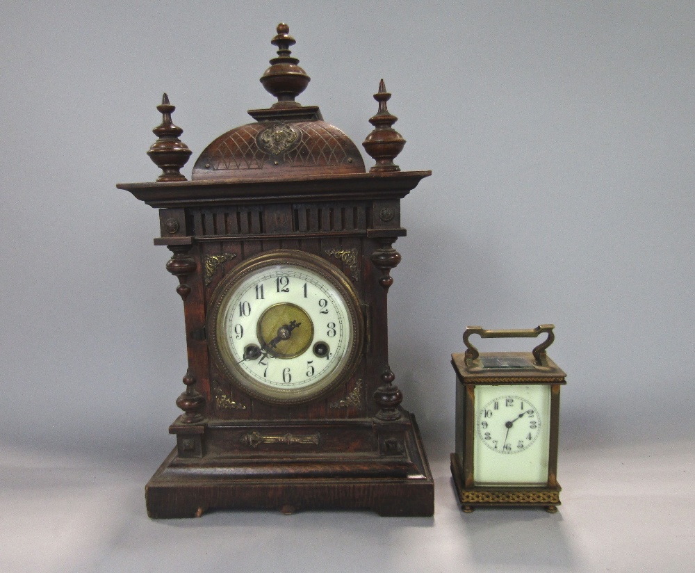 Continental twin train mantle clock with enamelled chapter ring and striking on a gong, 40 cm