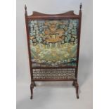 Edwardian mahogany firescreen with glazed fabric panel containing a remnant of a 19th century