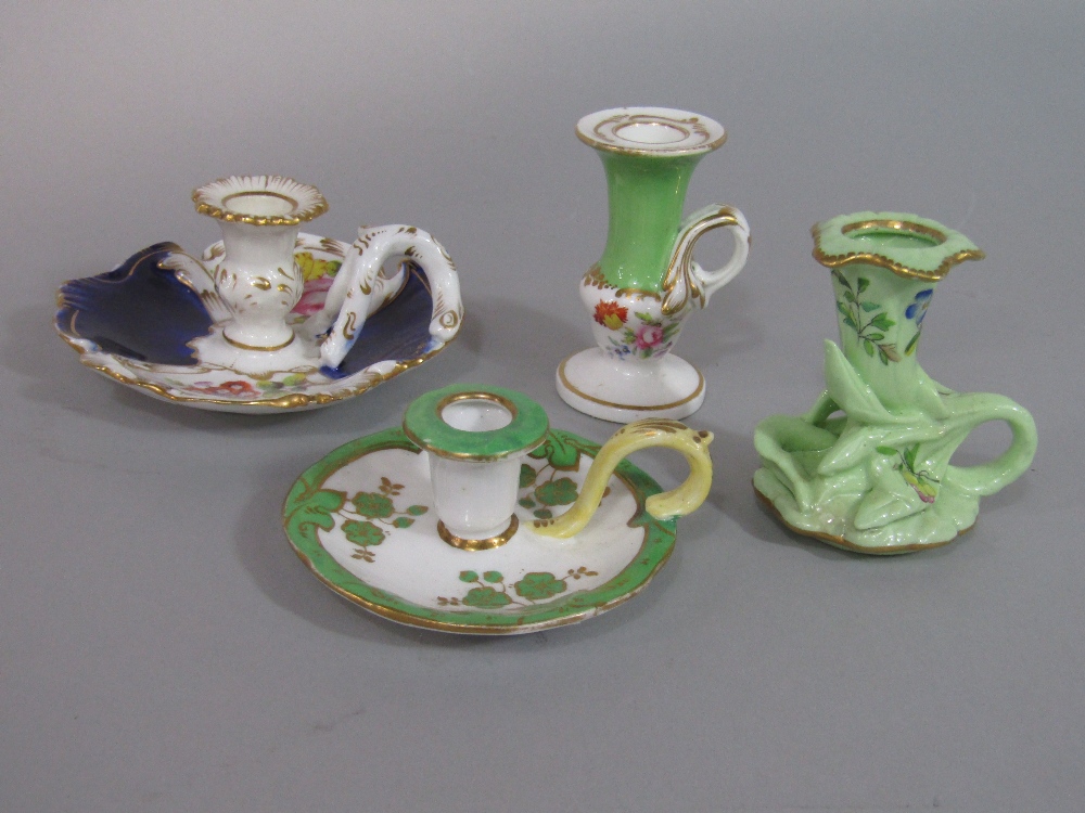A collection of four 19th century miniature candle and chamber sticks, with various floral