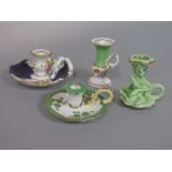 A collection of four 19th century miniature candle and chamber sticks, with various floral