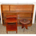 A retro teak veneered low bedside lamp table, on three tiers, a dwarf open bookcase, with