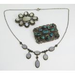 Good mixed lot comprising a scrolled white metal brooch set with cabochon turquoise, a further