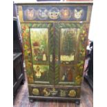 A 19th century continental pine cupboard enclosed by two panelled doors and two frieze drawers