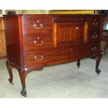 An unusual Edwardian mahogany bow front dresser fitted with an arrangement of five drawers