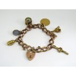 Antique 9ct curb link charm bracelet with heart padlock clasp, hung with an 1898 half sovereign, 9ct