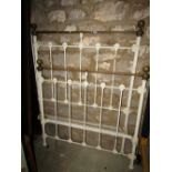 A Victorian brass and iron single bedstead, with cream painted finish