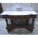 A Victorian mahogany veneered Duchess washstand with white and grey flecked shaped marble top and