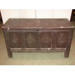 An 18th century oak coffer, with hinged lid, panelled frame and moulded styles, the front