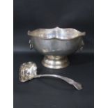 A twin handled silver plated punch bowl with gadrooned rim and twin lion head handles, upon a
